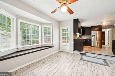 Welcome to this beautiful brick front home nestled on a sweeping on Hidden Hills Country Club in Georgia - for sale on GolfHomes.com, golf home, golf lot