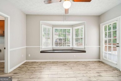 Welcome to this beautiful brick front home nestled on a sweeping on Hidden Hills Country Club in Georgia - for sale on GolfHomes.com, golf home, golf lot