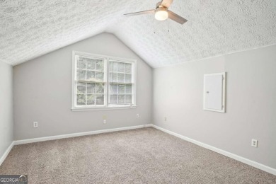 Welcome to this beautiful brick front home nestled on a sweeping on Hidden Hills Country Club in Georgia - for sale on GolfHomes.com, golf home, golf lot