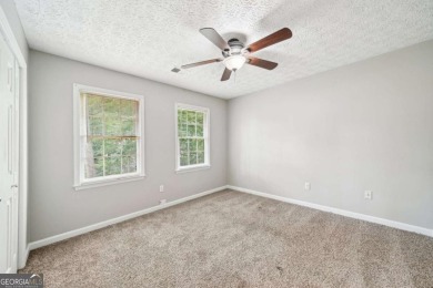 Welcome to this beautiful brick front home nestled on a sweeping on Hidden Hills Country Club in Georgia - for sale on GolfHomes.com, golf home, golf lot