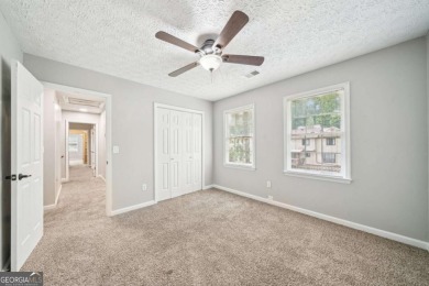 Welcome to this beautiful brick front home nestled on a sweeping on Hidden Hills Country Club in Georgia - for sale on GolfHomes.com, golf home, golf lot