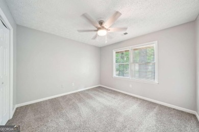 Welcome to this beautiful brick front home nestled on a sweeping on Hidden Hills Country Club in Georgia - for sale on GolfHomes.com, golf home, golf lot