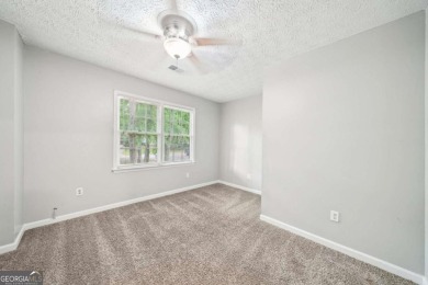 Welcome to this beautiful brick front home nestled on a sweeping on Hidden Hills Country Club in Georgia - for sale on GolfHomes.com, golf home, golf lot