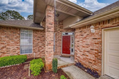 Located at 1456 Champions Green Drive in Gulf Breeze, Florida on Tiger Point Golf and Country Club in Florida - for sale on GolfHomes.com, golf home, golf lot