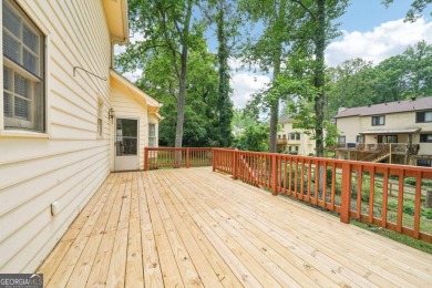 Welcome to this beautiful brick front home nestled on a sweeping on Hidden Hills Country Club in Georgia - for sale on GolfHomes.com, golf home, golf lot