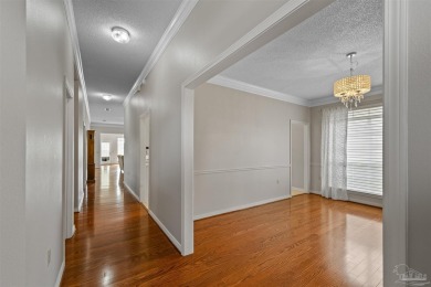 Located at 1456 Champions Green Drive in Gulf Breeze, Florida on Tiger Point Golf and Country Club in Florida - for sale on GolfHomes.com, golf home, golf lot