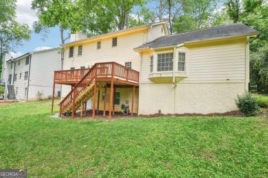 Welcome to this beautiful brick front home nestled on a sweeping on Hidden Hills Country Club in Georgia - for sale on GolfHomes.com, golf home, golf lot
