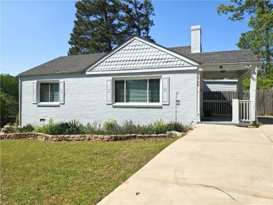 No HOA - Discover the perfect blend of contemporary elegance and on Charlie Yates Golf Course in Georgia - for sale on GolfHomes.com, golf home, golf lot