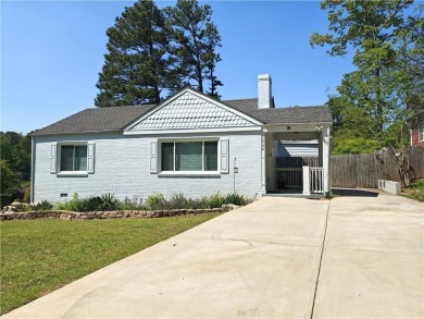No HOA - Discover the perfect blend of contemporary elegance and on Charlie Yates Golf Course in Georgia - for sale on GolfHomes.com, golf home, golf lot