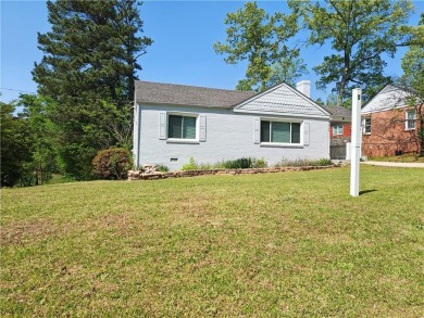 No HOA - Discover the perfect blend of contemporary elegance and on Charlie Yates Golf Course in Georgia - for sale on GolfHomes.com, golf home, golf lot