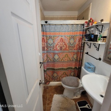 Discover this 3-bedroom, 2-bathroom home nestled right on the on Pass Christian Isles Golf Club in Mississippi - for sale on GolfHomes.com, golf home, golf lot