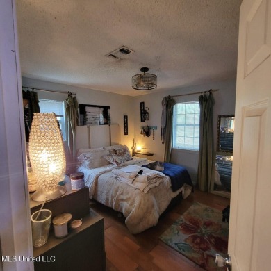 Discover this 3-bedroom, 2-bathroom home nestled right on the on Pass Christian Isles Golf Club in Mississippi - for sale on GolfHomes.com, golf home, golf lot