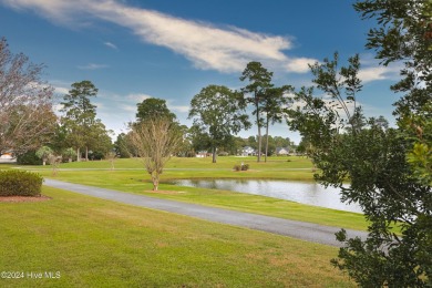 Incredible pond and golf course views await you in this 3 on Brunswick Plantation and Golf Resorts in North Carolina - for sale on GolfHomes.com, golf home, golf lot