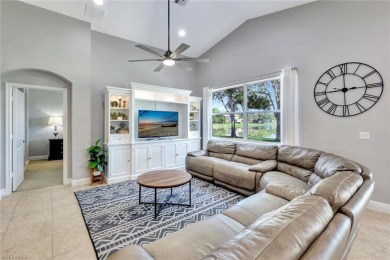 Enjoy sparkling lake and serene golf course views in this on Valencia Golf and Country Club in Florida - for sale on GolfHomes.com, golf home, golf lot