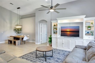 Enjoy sparkling lake and serene golf course views in this on Valencia Golf and Country Club in Florida - for sale on GolfHomes.com, golf home, golf lot