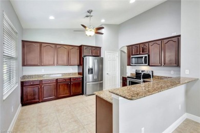 Enjoy sparkling lake and serene golf course views in this on Valencia Golf and Country Club in Florida - for sale on GolfHomes.com, golf home, golf lot