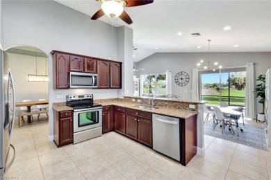 Enjoy sparkling lake and serene golf course views in this on Valencia Golf and Country Club in Florida - for sale on GolfHomes.com, golf home, golf lot