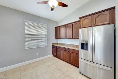 Enjoy sparkling lake and serene golf course views in this on Valencia Golf and Country Club in Florida - for sale on GolfHomes.com, golf home, golf lot