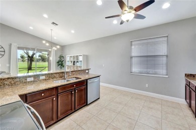 Enjoy sparkling lake and serene golf course views in this on Valencia Golf and Country Club in Florida - for sale on GolfHomes.com, golf home, golf lot