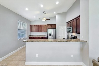 Enjoy sparkling lake and serene golf course views in this on Valencia Golf and Country Club in Florida - for sale on GolfHomes.com, golf home, golf lot