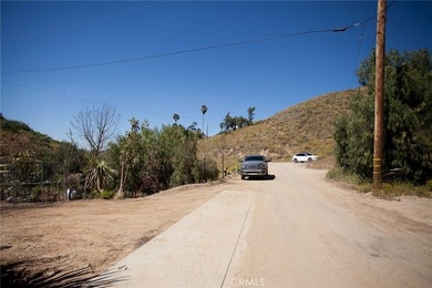 Perched atop a scenic hillside in the highly desirable Temescal on Glen Ivy Golf Club in California - for sale on GolfHomes.com, golf home, golf lot