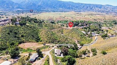Perched atop a scenic hillside in the highly desirable Temescal on Glen Ivy Golf Club in California - for sale on GolfHomes.com, golf home, golf lot