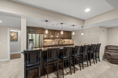 Experience elegance and timeless craftsmanship in this on Heritage Park Golf Course in Kansas - for sale on GolfHomes.com, golf home, golf lot