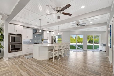 This One of a Kind Fully Renovated 5 Bedroom, 4 Bath Pool Home on BallenIsles Golf and Country Club in Florida - for sale on GolfHomes.com, golf home, golf lot