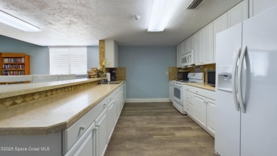 3rd FLOOR CORNER UNIT WITH 2 BALCONIES AN 2 DEEDED PARKING on Manatee Cove Golf Course in Florida - for sale on GolfHomes.com, golf home, golf lot