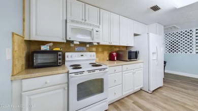 3rd FLOOR CORNER UNIT WITH 2 BALCONIES AN 2 DEEDED PARKING on Manatee Cove Golf Course in Florida - for sale on GolfHomes.com, golf home, golf lot