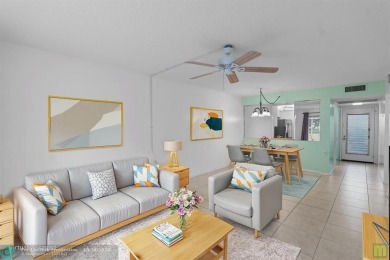 Resort-style living can be yours in the beautiful community of on Wynmoor Golf Course in Florida - for sale on GolfHomes.com, golf home, golf lot