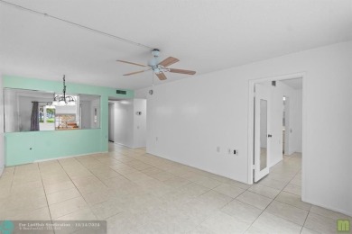 Resort-style living can be yours in the beautiful community of on Wynmoor Golf Course in Florida - for sale on GolfHomes.com, golf home, golf lot