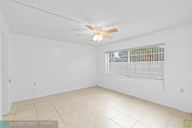 Resort-style living can be yours in the beautiful community of on Wynmoor Golf Course in Florida - for sale on GolfHomes.com, golf home, golf lot