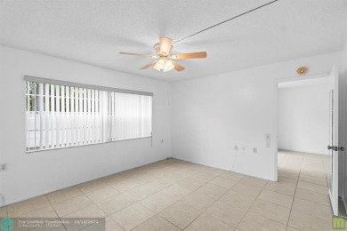 Resort-style living can be yours in the beautiful community of on Wynmoor Golf Course in Florida - for sale on GolfHomes.com, golf home, golf lot