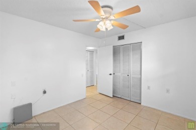 Resort-style living can be yours in the beautiful community of on Wynmoor Golf Course in Florida - for sale on GolfHomes.com, golf home, golf lot