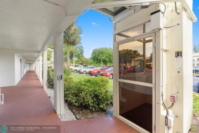 Resort-style living can be yours in the beautiful community of on Wynmoor Golf Course in Florida - for sale on GolfHomes.com, golf home, golf lot