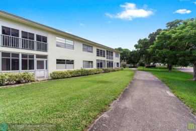 Resort-style living can be yours in the beautiful community of on Wynmoor Golf Course in Florida - for sale on GolfHomes.com, golf home, golf lot