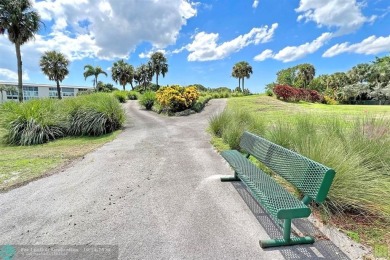 Resort-style living can be yours in the beautiful community of on Wynmoor Golf Course in Florida - for sale on GolfHomes.com, golf home, golf lot