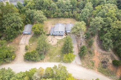 Unique and full of charm, this home sits on four lots totaling 2 on Terre Du Lac Golf and Country Club in Missouri - for sale on GolfHomes.com, golf home, golf lot