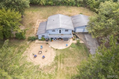 Unique and full of charm, this home sits on four lots totaling 2 on Terre Du Lac Golf and Country Club in Missouri - for sale on GolfHomes.com, golf home, golf lot