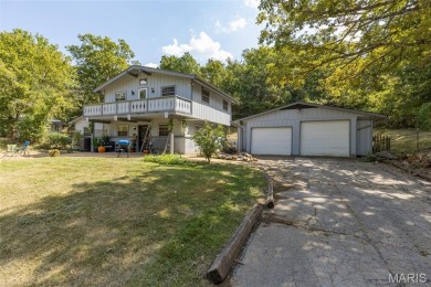 Unique and full of charm, this home sits on four lots totaling 2 on Terre Du Lac Golf and Country Club in Missouri - for sale on GolfHomes.com, golf home, golf lot