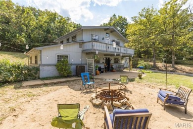 Unique and full of charm, this home sits on four lots totaling 2 on Terre Du Lac Golf and Country Club in Missouri - for sale on GolfHomes.com, golf home, golf lot
