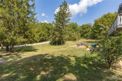 Unique and full of charm, this home sits on four lots totaling 2 on Terre Du Lac Golf and Country Club in Missouri - for sale on GolfHomes.com, golf home, golf lot