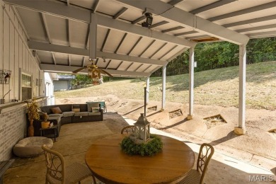 Unique and full of charm, this home sits on four lots totaling 2 on Terre Du Lac Golf and Country Club in Missouri - for sale on GolfHomes.com, golf home, golf lot