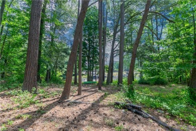 Nice one-story waterfront cottage.  Lake Caroline is on Pendleton Golf Club in Virginia - for sale on GolfHomes.com, golf home, golf lot