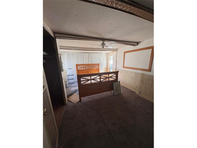 Welcome home to this 2-bedroom, 2-bath residence located in the on Betmar Acres Golf Club in Florida - for sale on GolfHomes.com, golf home, golf lot