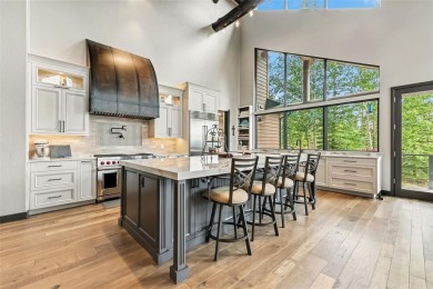 This stunning Highlands at Breckenridge retreat sits on over an on Breckenridge Golf Club in Colorado - for sale on GolfHomes.com, golf home, golf lot
