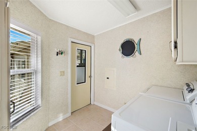 Enjoy Florida waterfront living - and move right in, as this on Pine Lakes Country Club in Florida - for sale on GolfHomes.com, golf home, golf lot