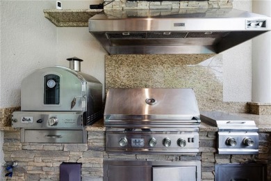 THIS HOME HAS IT ALL! New roof, flood barriers, hurricane impact on West Bay Beach and Golf Club in Florida - for sale on GolfHomes.com, golf home, golf lot