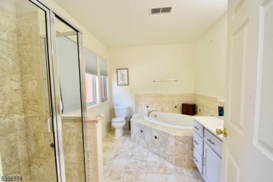 This 3-bedroom, 3-bath end-unit townhome isn't just a place to on Minerals Golf Club in New Jersey - for sale on GolfHomes.com, golf home, golf lot